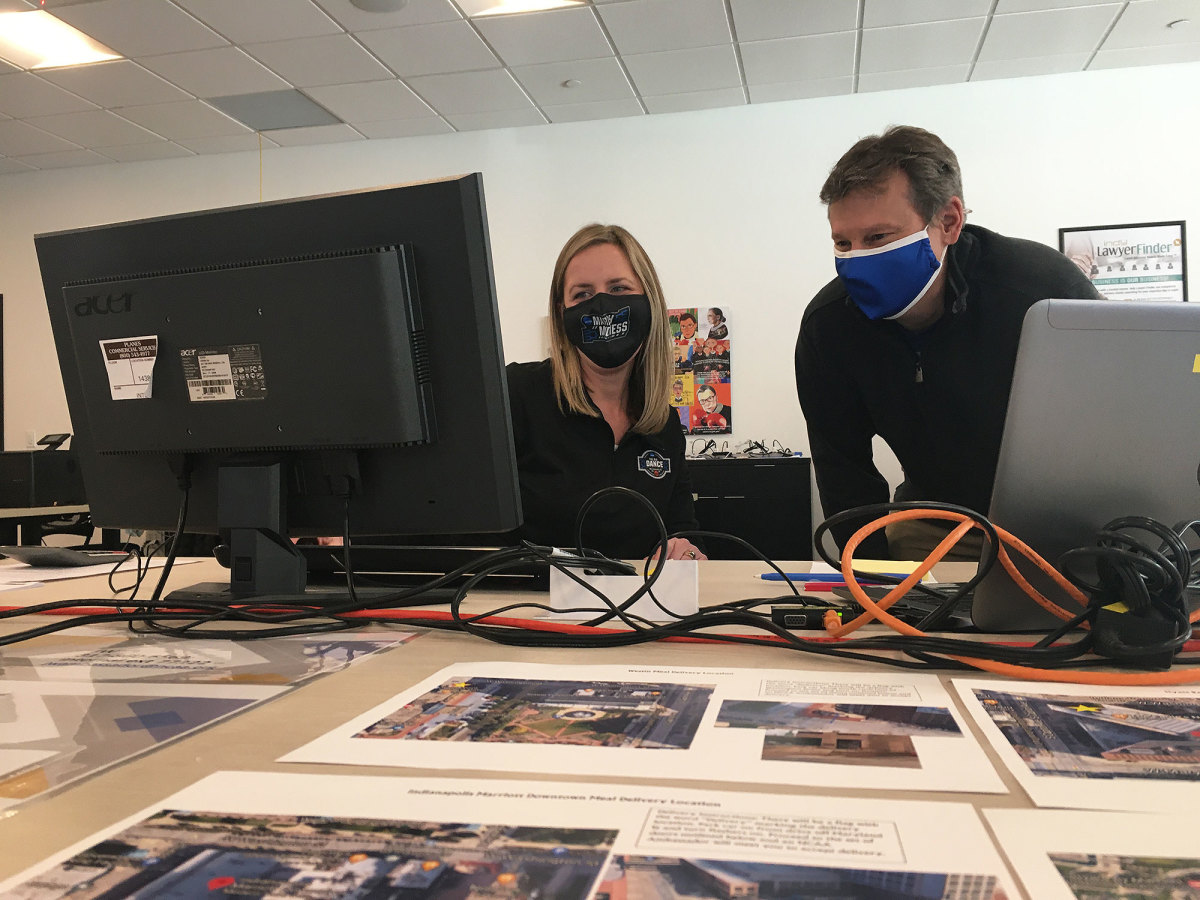 Brian Bowman, right, speaks with Heather Vaughn from the host program's headquarters in downtown Indianapolis.